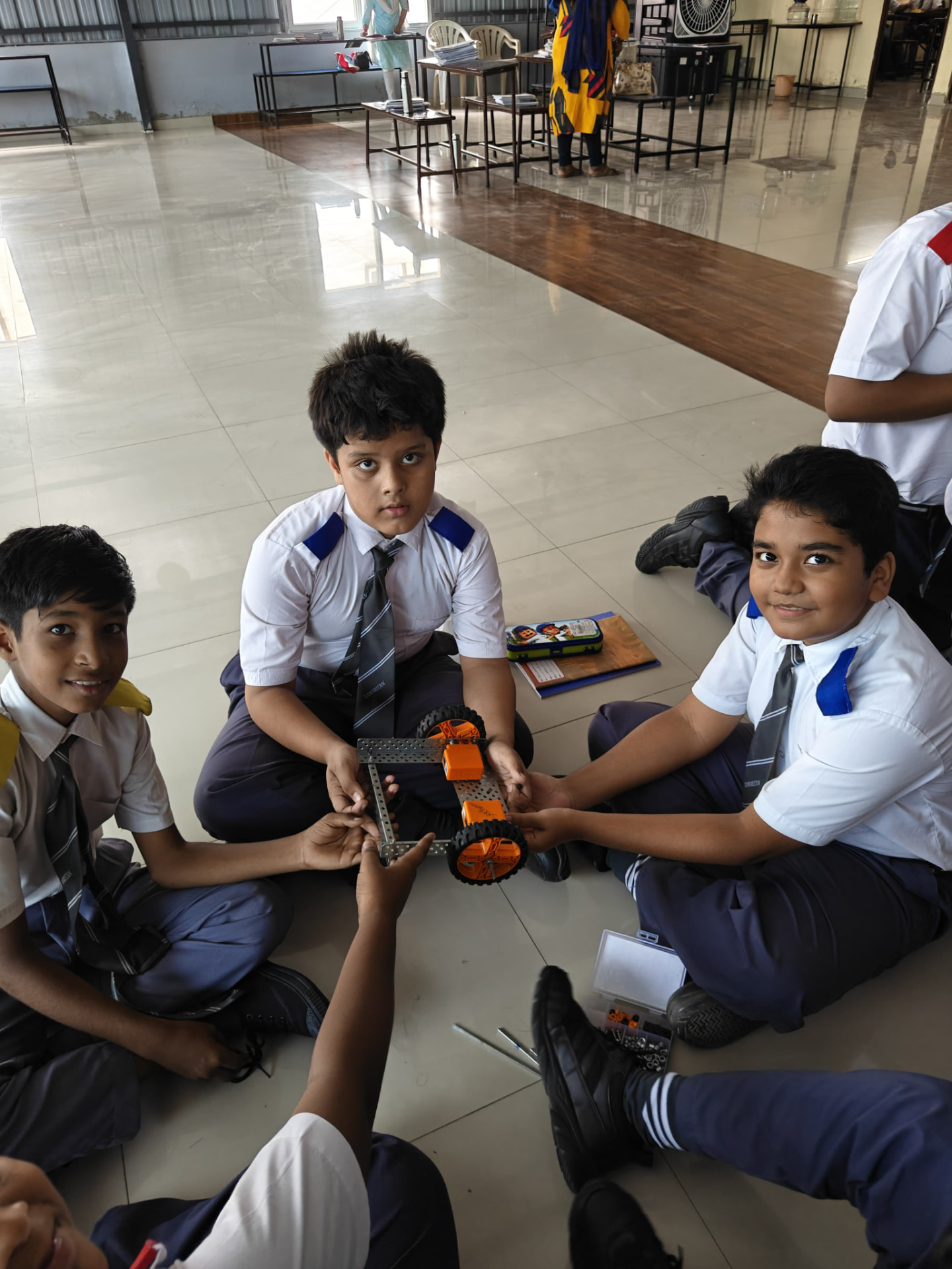 Students building a robotics kit